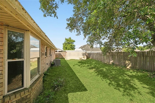 view of yard with central air condition unit