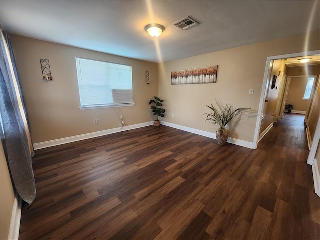 empty room featuring dark hardwood / wood-style floors