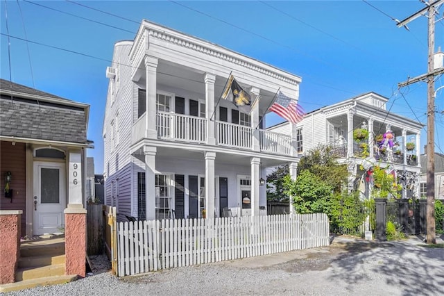 view of front of property with a porch and a balcony