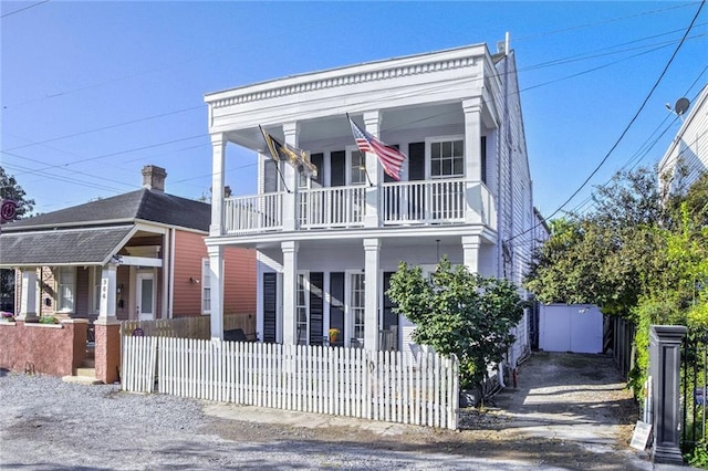 view of front of house with a balcony