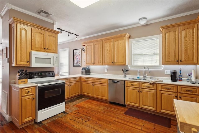 kitchen with ornamental molding, sink, dark wood-type flooring, and white appliances