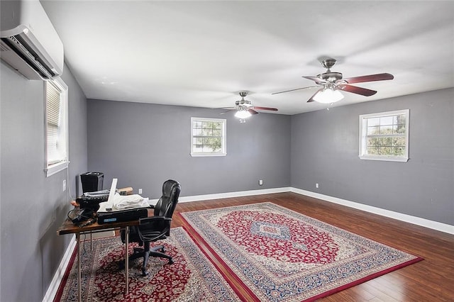 office area featuring ceiling fan, a wealth of natural light, a wall mounted air conditioner, and dark hardwood / wood-style flooring