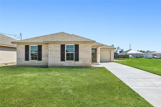 ranch-style house featuring a front yard and a garage