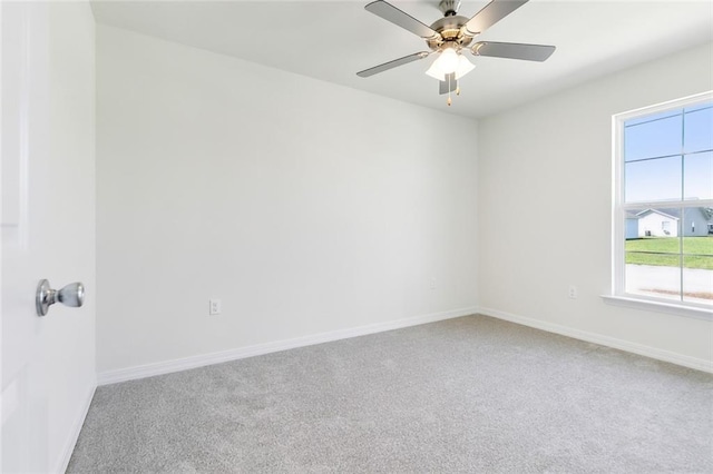 unfurnished room featuring carpet flooring and ceiling fan