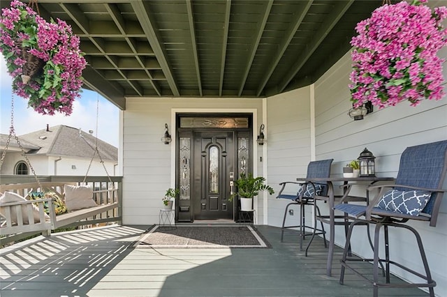 doorway to property with a porch