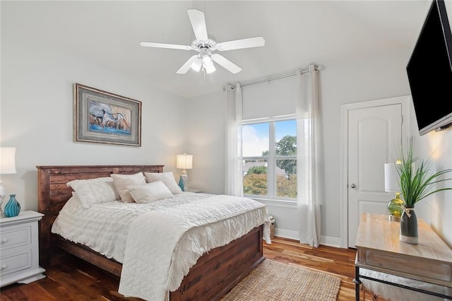 bedroom featuring ceiling fan and dark wood-type flooring