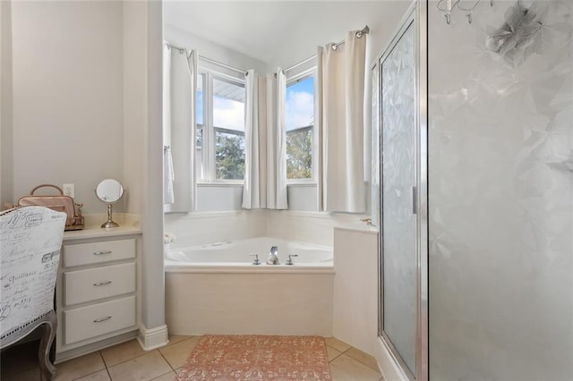 bathroom featuring tile patterned flooring and shower with separate bathtub