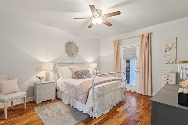 bedroom with ceiling fan and hardwood / wood-style floors