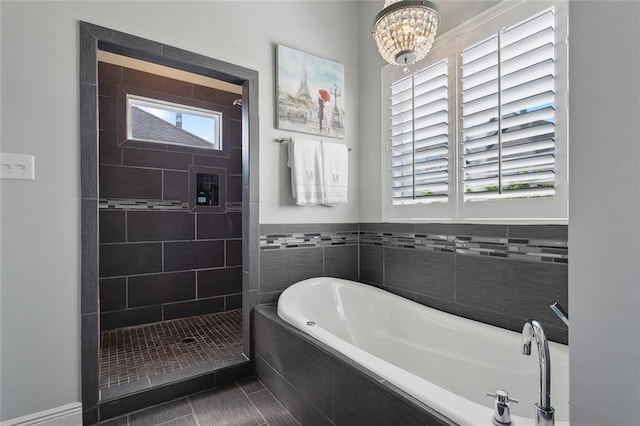 bathroom with tile patterned floors and plus walk in shower