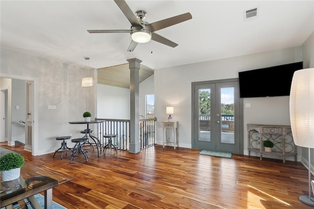 living room featuring hardwood / wood-style floors, french doors, and ceiling fan