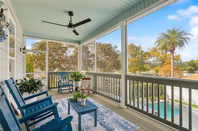 sunroom featuring ceiling fan