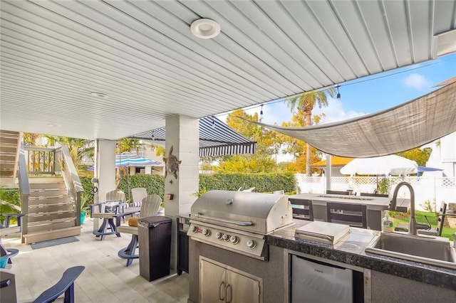 view of patio featuring grilling area, sink, and area for grilling