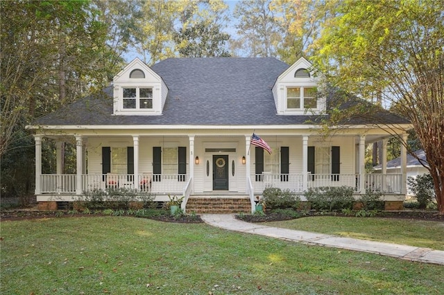 farmhouse featuring covered porch and a front lawn