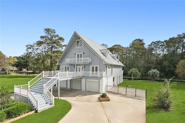 69027 Riverbend Dr, Covington, LA 70433 - view of front of property featuring a balcony, driveway, board and batten siding, stairway, and an attached garage