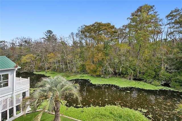 view of water feature with a view of trees