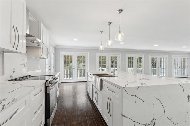 kitchen with white cabinets, ornamental molding, a sink, stainless steel electric stove, and french doors