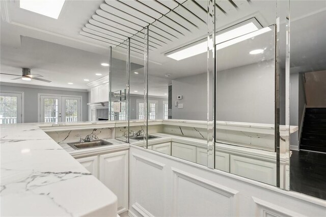 69027 Riverbend Dr, Covington, LA 70433 - kitchen featuring white cabinets, light stone counters, a ceiling fan, recessed lighting, and french doors
