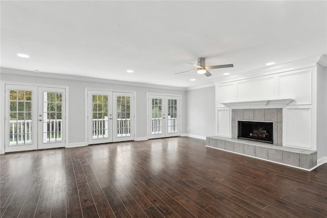 unfurnished living room featuring french doors, a ceiling fan, crown molding, and baseboards