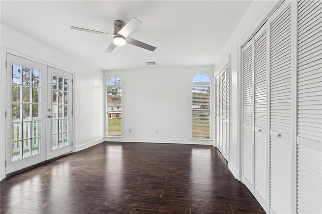 unfurnished bedroom with french doors, ceiling fan, and dark hardwood / wood-style flooring