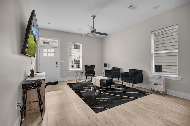 interior space featuring ceiling fan and light wood-type flooring