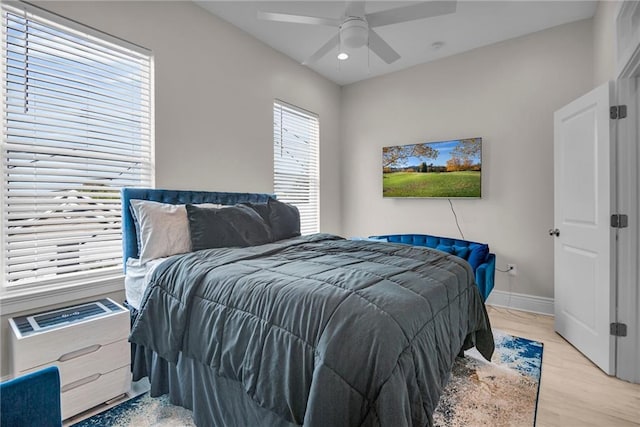 bedroom with ceiling fan and light wood-type flooring