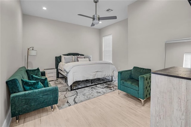 bedroom with wood-type flooring and ceiling fan