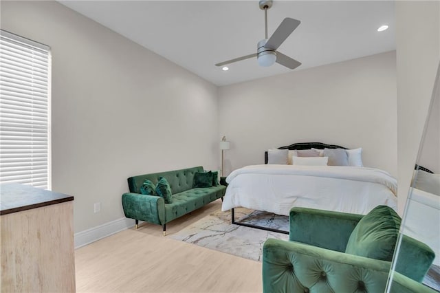 bedroom with ceiling fan and hardwood / wood-style flooring