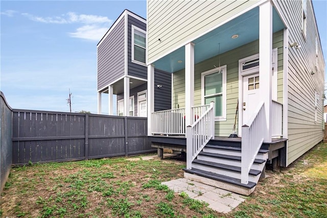 rear view of house with covered porch