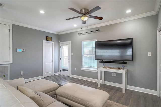 living room featuring ceiling fan, dark wood-type flooring, and ornamental molding