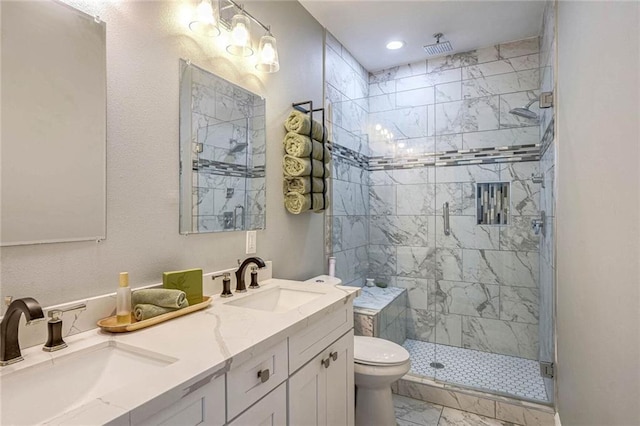 bathroom featuring vanity, toilet, and walk in shower