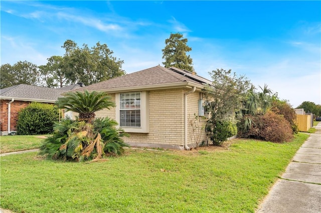 view of property exterior featuring a lawn