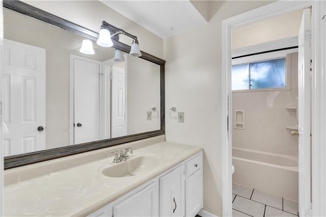 bathroom featuring vanity, tile patterned floors, and shower / bathtub combination