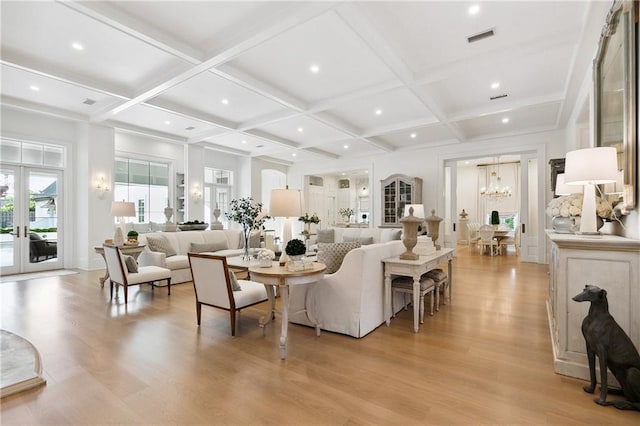 living room with beamed ceiling, french doors, light hardwood / wood-style floors, and coffered ceiling