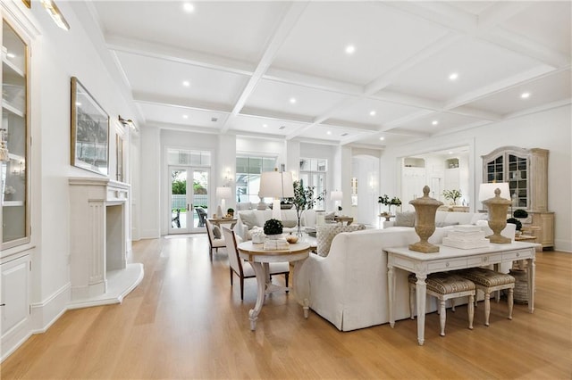 living room with beamed ceiling, light hardwood / wood-style flooring, and coffered ceiling