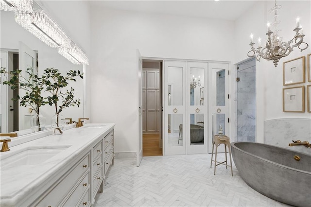 bathroom featuring vanity, a towering ceiling, and a bath