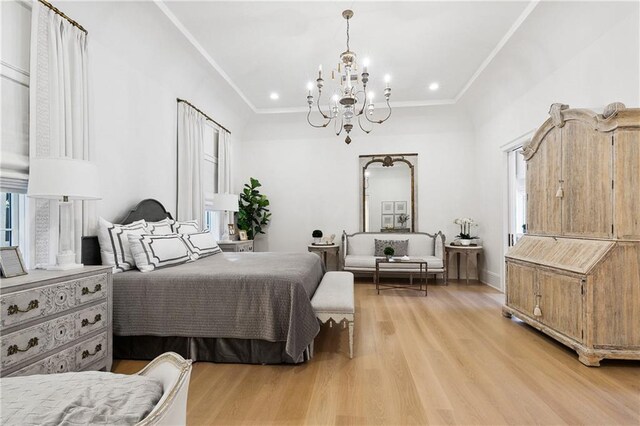 bedroom featuring an inviting chandelier, crown molding, and light hardwood / wood-style flooring