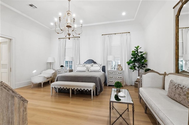 bedroom with crown molding, light hardwood / wood-style flooring, and an inviting chandelier