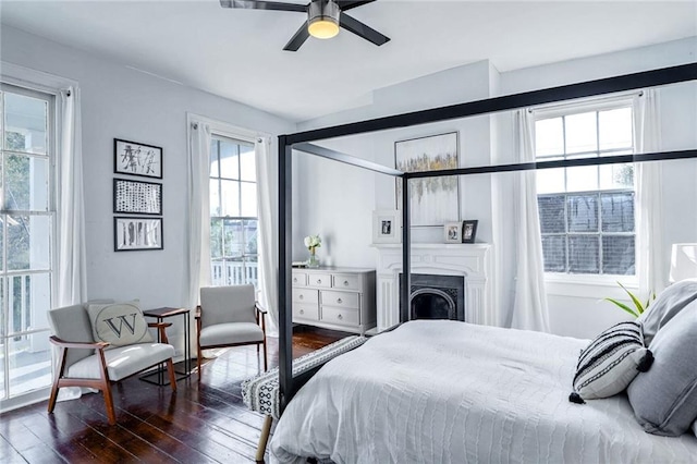 bedroom featuring ceiling fan and dark hardwood / wood-style floors