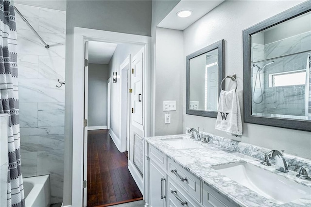 bathroom featuring vanity, shower / bath combo, and hardwood / wood-style flooring