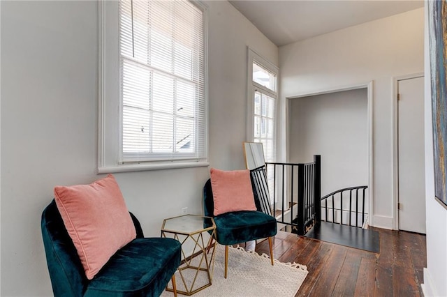 sitting room featuring dark hardwood / wood-style flooring