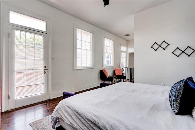 bedroom featuring dark wood-type flooring