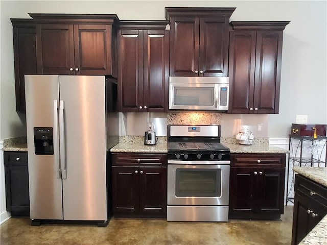 kitchen with light stone countertops, appliances with stainless steel finishes, and dark brown cabinets