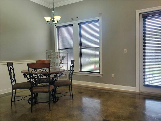 dining room featuring a wealth of natural light, crown molding, and a chandelier