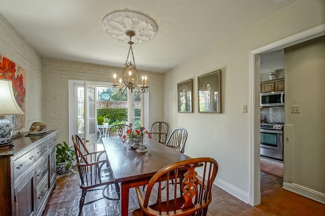 dining space with a chandelier