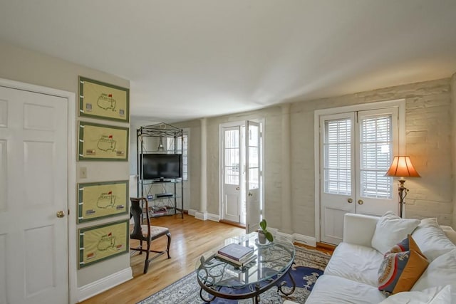 living room with a wealth of natural light and hardwood / wood-style floors