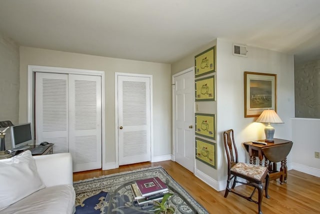 sitting room featuring hardwood / wood-style flooring