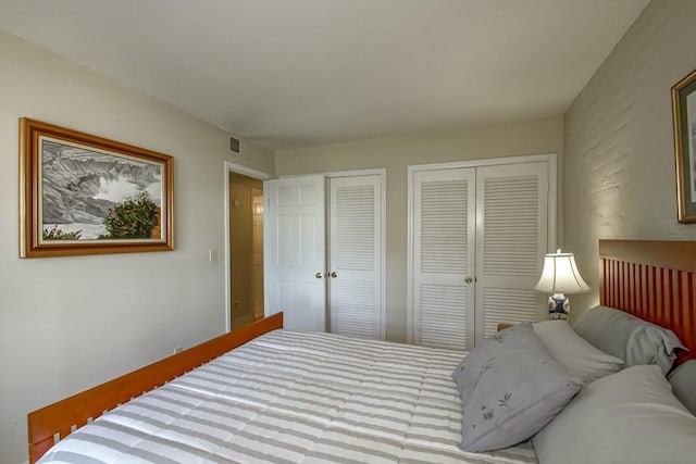 bedroom featuring two closets