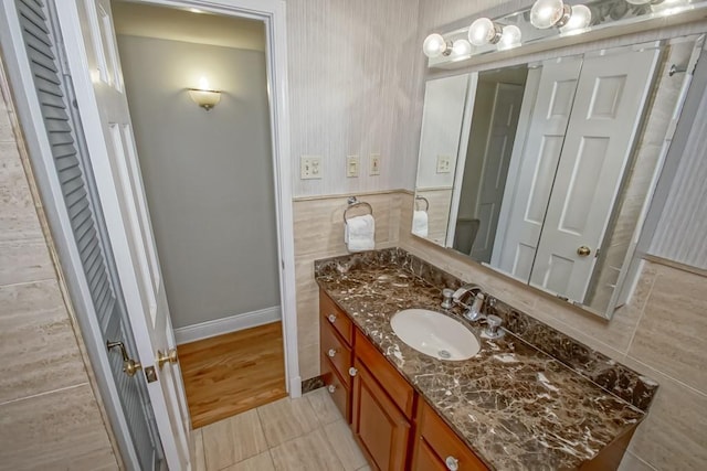 bathroom featuring vanity and hardwood / wood-style flooring