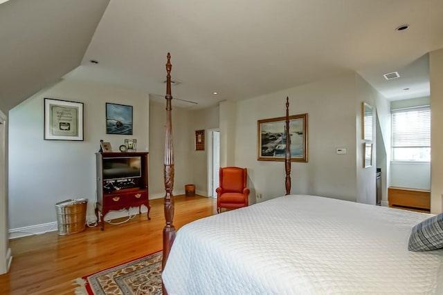 bedroom with hardwood / wood-style flooring