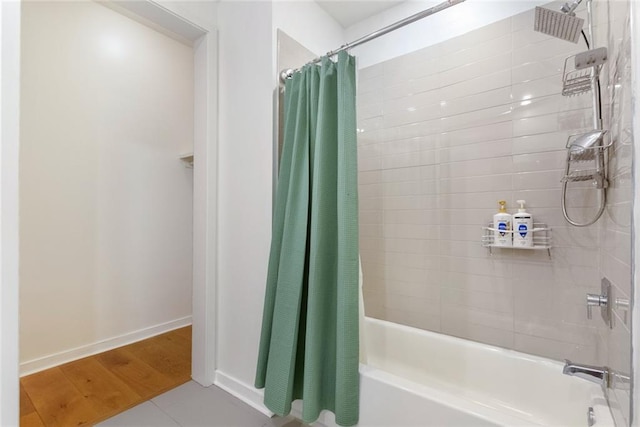 bathroom with tile patterned flooring, shower / bath combo, and vanity